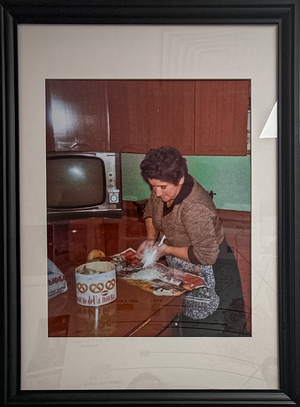Framed photo of grandmother cooking